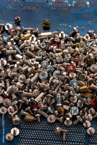 Accessories for mounting electronic components. Repair of computer parts. Close-up. Vertical.