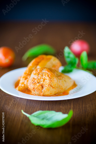 stuffed pepper with meat and vegetable sauce in a plate