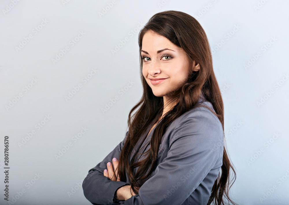 Beautiful young happy success business woman with finger under the face thinking and looking in grey suit and long hair.