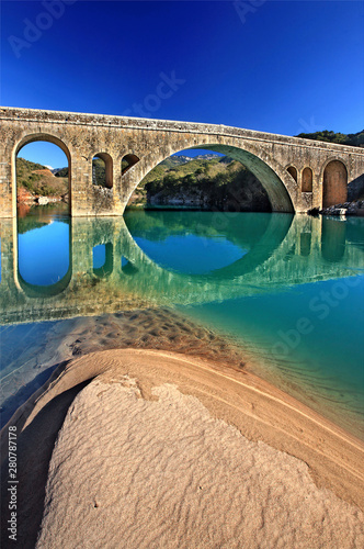 The stone arched bridge of Katafylli - Avlaki, crossing Acheloos river, connecting Karditsa (Thessaly) & Aitoloakarnania, Greece  photo