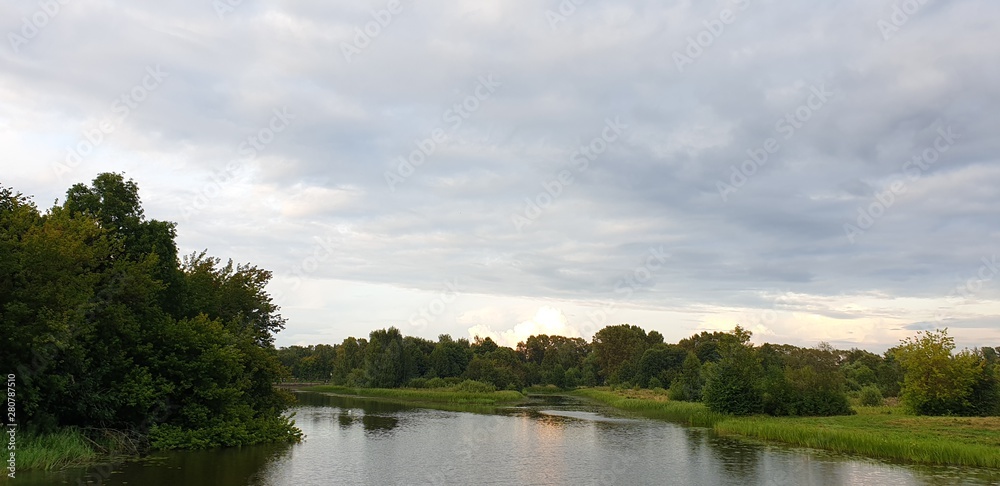 Lake in the evening. River at dusk. Ecologically clean area.