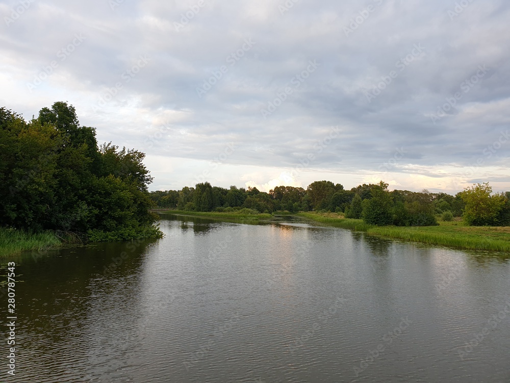 Fototapeta premium Lake in the evening. River at dusk. Ecologically clean area.