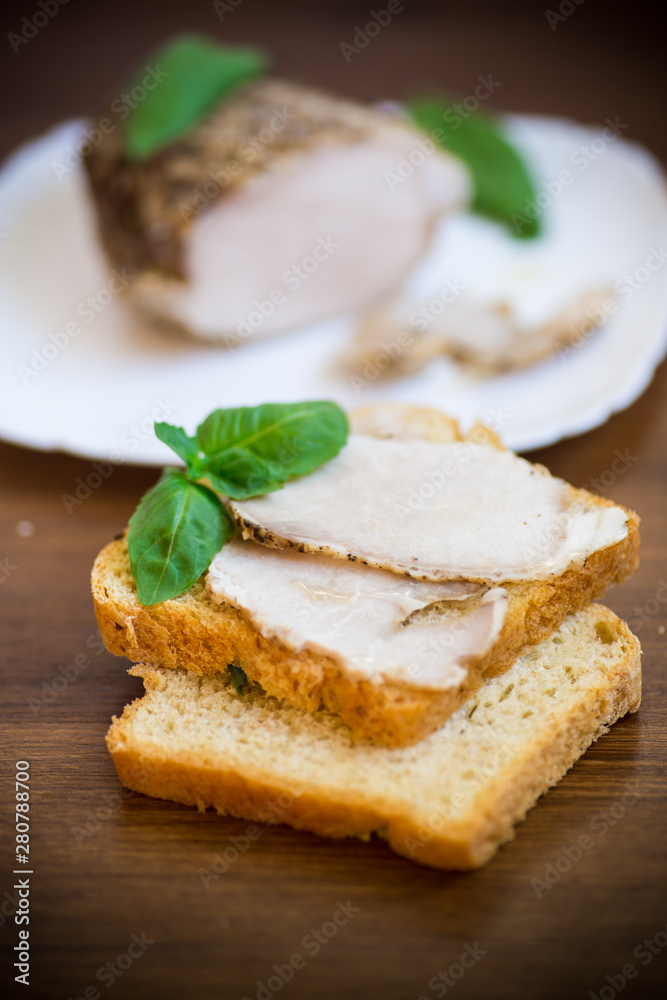 sandwich with home baked meat in a plate on a wooden sandwich with home baked meat in a plate on a wooden