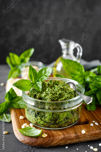 Traditional italian pesto alla genovese with fresh basil leaves, pine nuts, olive oil, garlic and parmesan cheese