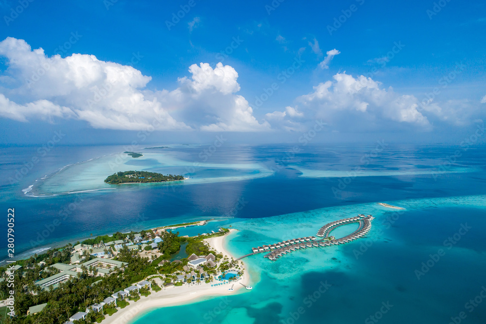Aerial view of beautiful island at Maldives in the Indian Ocean. Top view  from drone. Photos | Adobe Stock