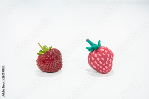 Comparison of two strawberries - Real and Fake.