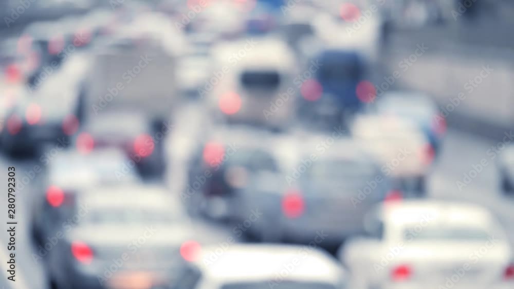 Blured traffic jams background. Cars in intensive traffic in unpleasent weather shot from behind. Slow motion. Blured traffic jams background. Cars in intensive traffic in unpleasent weather shot from behind. Slow motion.