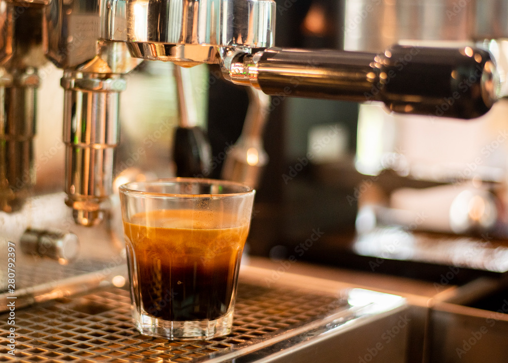 Close up of coffee machine is preparing coffee in coffee shop Close up of coffee machine is preparing coffee in coffee shop