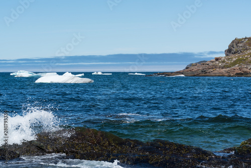 Iceberg floating in the ocean off the coast of Newfoundland Canada