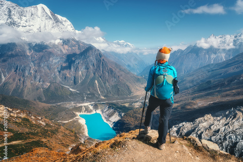 Standing woman with backpac...