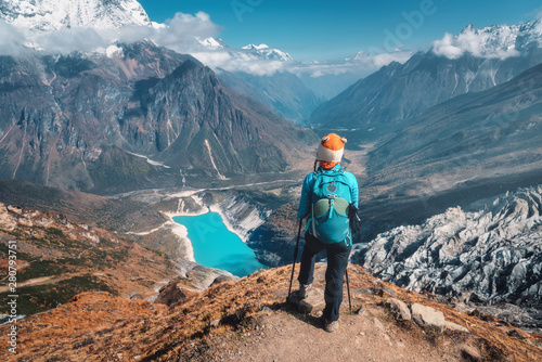 Standing woman with backpac...