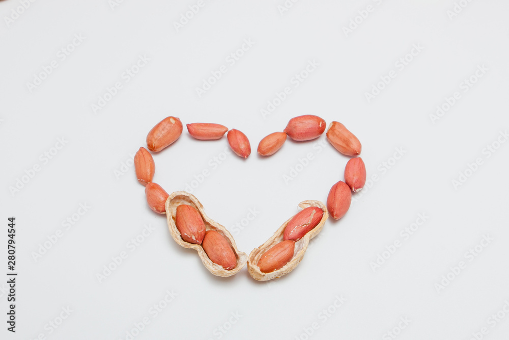 Peanuts, for background or textures. Uncleaned inshell peanuts. Peanuts isolated on white background. Valentine's Day, Flat lay. Copy space. Peanuts, for background or textures. Uncleaned inshell peanuts. Peanuts isolated on white background. Valentine's Day, Flat lay. Copy space.