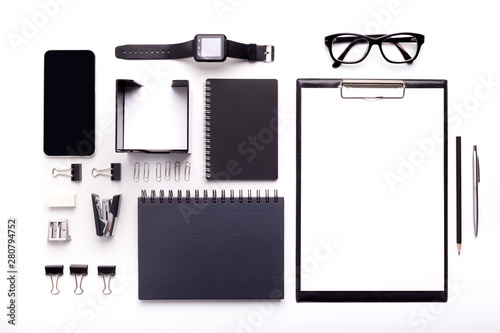 Set of office supplies with watches and glasses on background