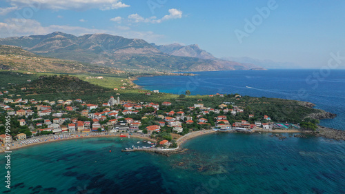 Aerial drone panoramic photo of iconic picturesque village and sandy beach of Stoupa in the heart of Messinian Mani, Peloponnese, Greece © aerial-drone