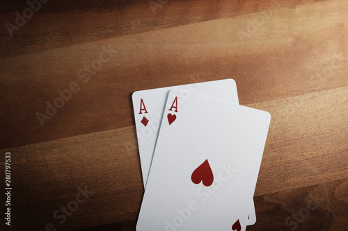 Poker Chips with Playing Cards on a Beautiful Wooden Table