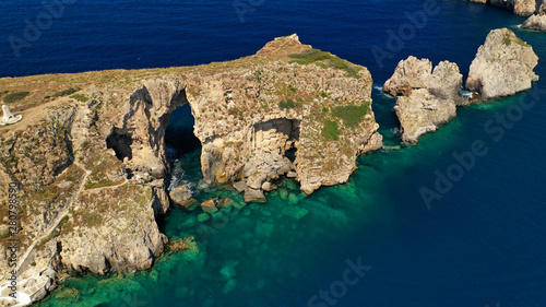 Aerial drone photo of small islet (Pilos) with iconic rocky arch and monument of French naval forces in Battle of Navarino called Pylos next to Sfaktiria island, Pylos, Peloponnese, Messinia, Greece photo