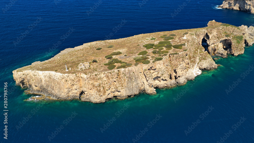 Aerial drone photo of small islet (Pilos) with iconic rocky arch and monument of French naval forces in Battle of Navarino called Pylos next to Sfaktiria island, Pylos, Peloponnese, Messinia, Greece