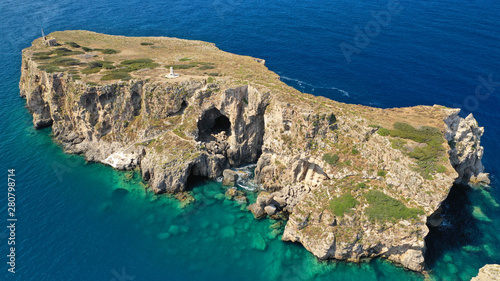 Aerial drone photo of small islet (Pilos) with iconic rocky arch and monument of French naval forces in Battle of Navarino called Pylos next to Sfaktiria island, Pylos, Peloponnese, Messinia, Greece