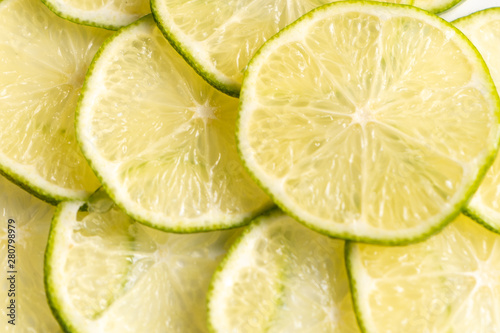 Close-up. Lime slices background. Top view