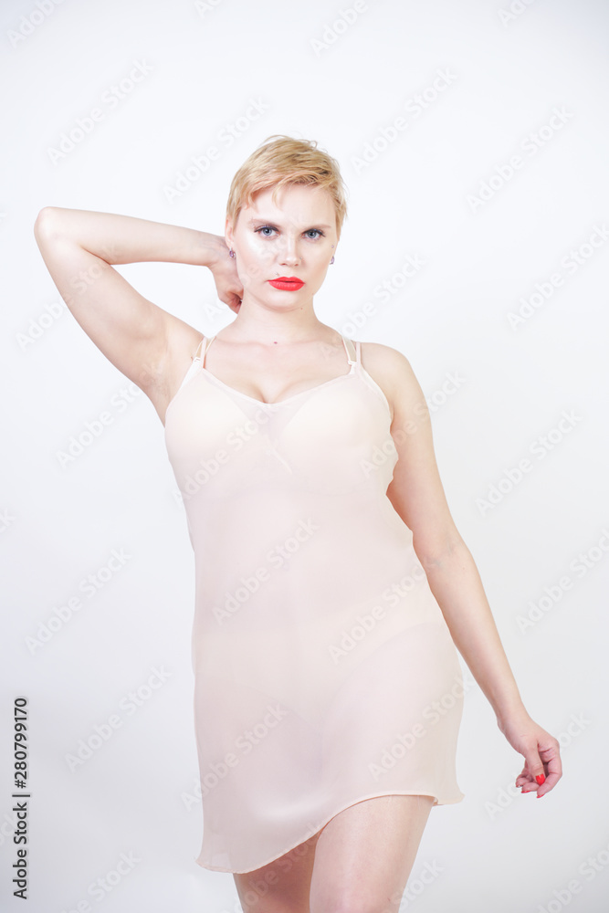 pretty elegant chubby girl in beige classic silk dress pretty elegant chubby girl in beige classic silk dress