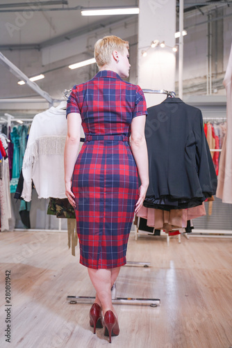 pretty plus size short hair girl in shopping process