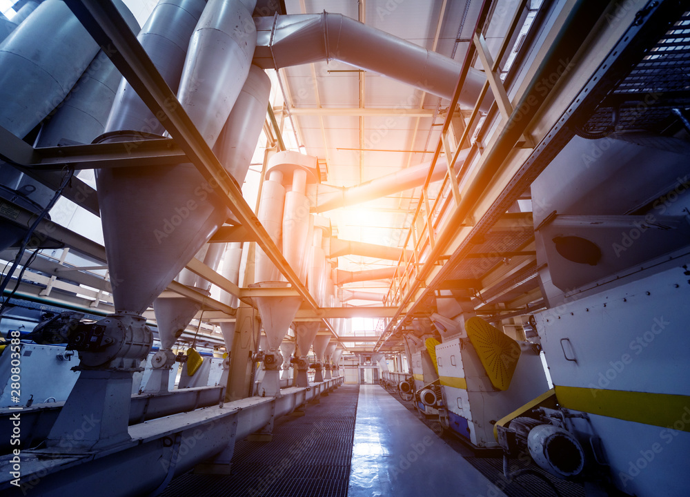 Fototapeta premium Interior of modern natural oil factory. The piping, pumps and motors