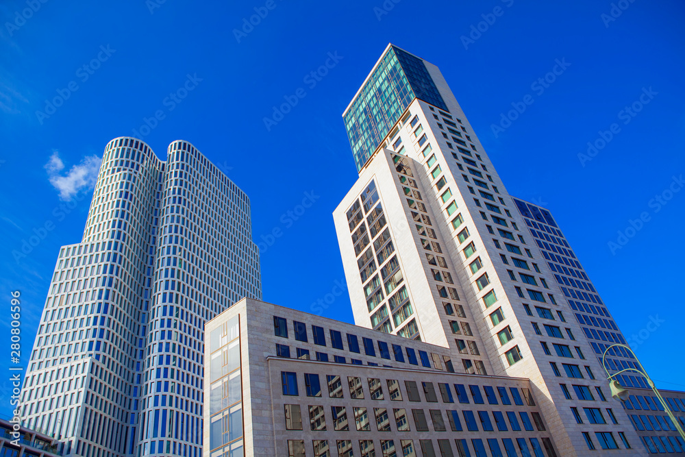 Modern skyscrapers as residential apartment house and office building architecture in Berlin Modern skyscrapers as residential apartment house and office building architecture in Berlin