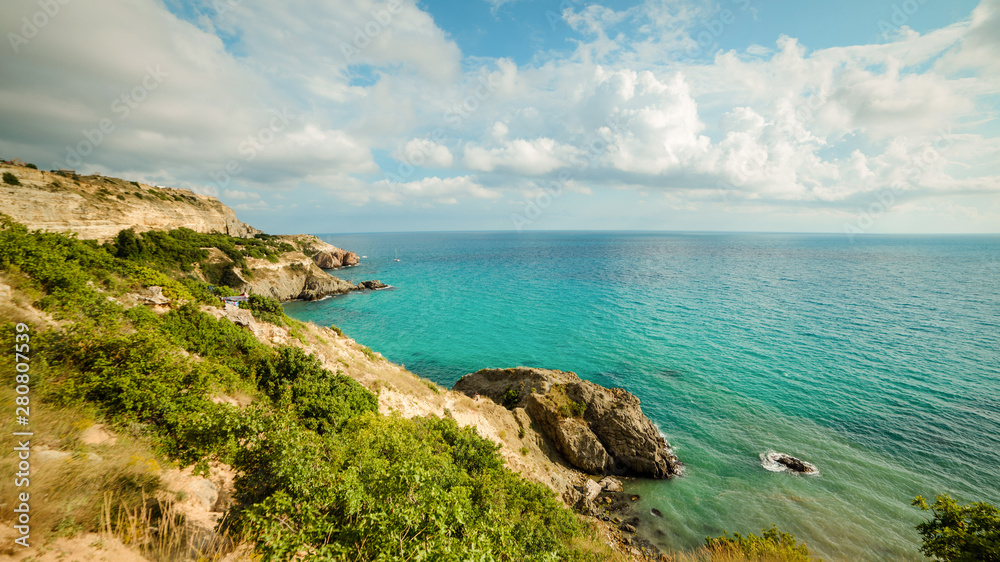 Yachts in the bay of the blue tropical sea