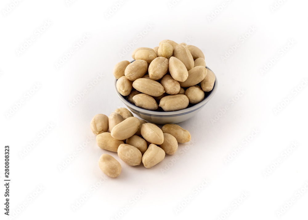 group of raw skinless peanuts on white background group of raw skinless peanuts on white background