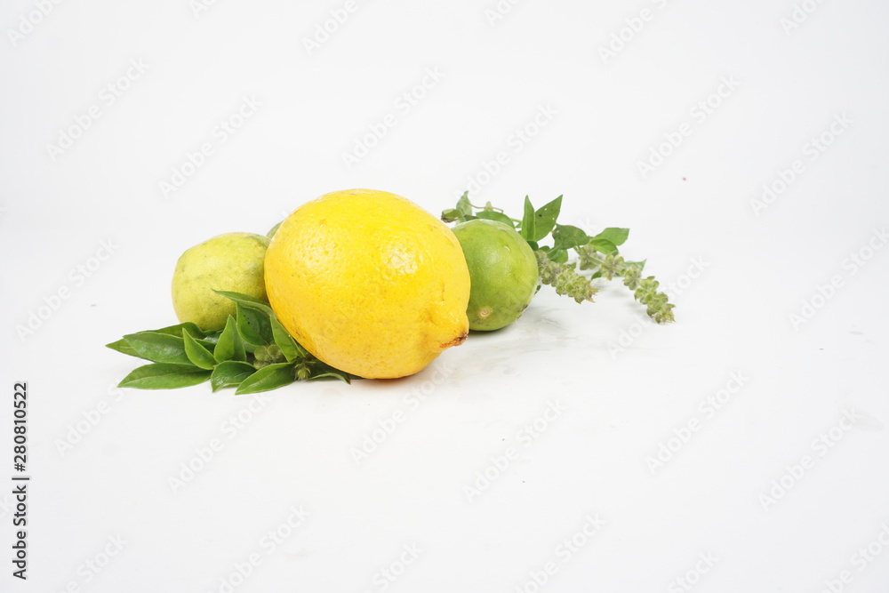 lemons with leaves on white background