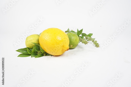 lemons with leaves on white background