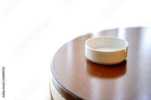 White ashtray on the wood table