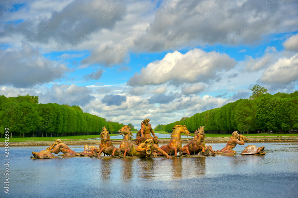 Versailles, France - April 24, 2019: Fountain of Apollo in the garden of Versailles Palace on a sunny day outside of Paris, France.