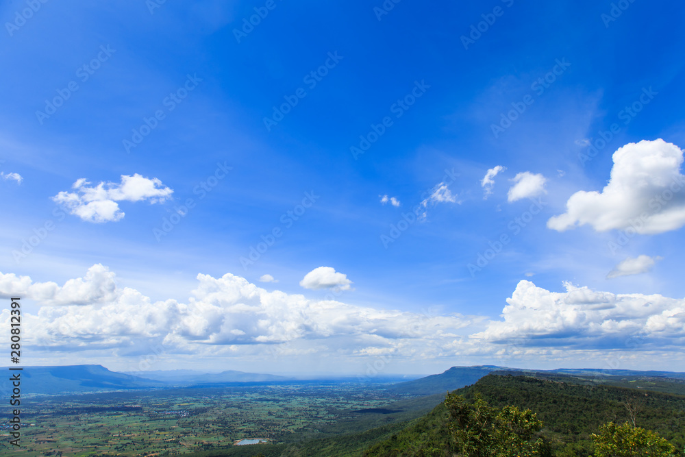 Green mountain with blue sky and White clouds background on sunny day at More Hin Khao, Phu Laen Kha National park, Chiayaphum, Thailand 