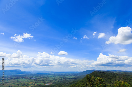 Green mountain with blue sky and White clouds background on sunny day at More Hin Khao, Phu Laen Kha National park, Chiayaphum, Thailand 