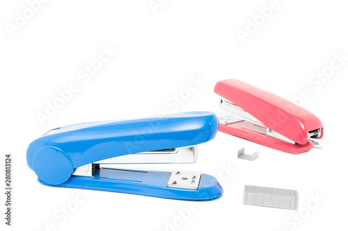 Top view of two stapler with pile of staples isolate on white background.