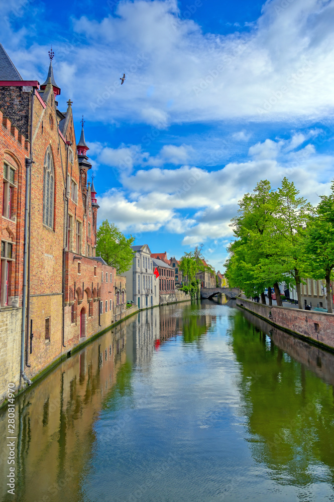 The canals of Bruges (Brugge), Belgium on a sunny day.