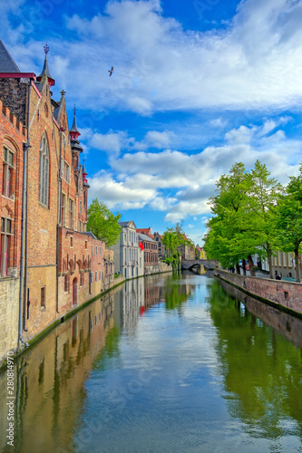 Obraz na płótnie The canals of Bruges (Brugge), Belgium on a sunny day. w salonie