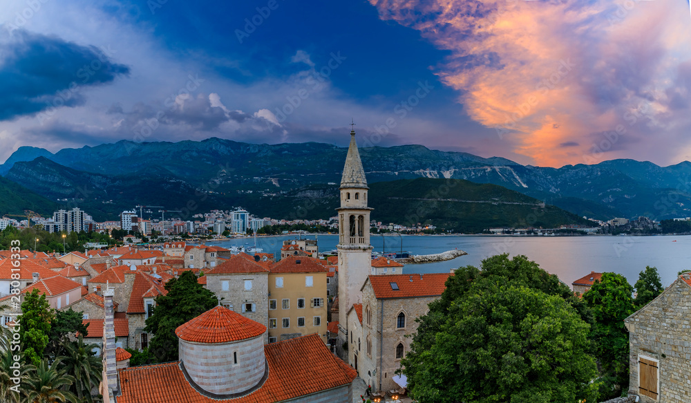Budva Old Town aerial sunset view from the Citadel with the Holy Trinity church and Adriatic Sea in Montenegro, Balkans