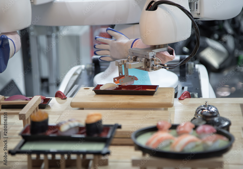 Smart robot preparing japanese food a dish of sushi Smart robot preparing japanese food a dish of sushi