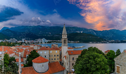 Budva Old Town aerial sunset view from the Citadel with the Holy Trinity church and Adriatic Sea in Montenegro, Balkans