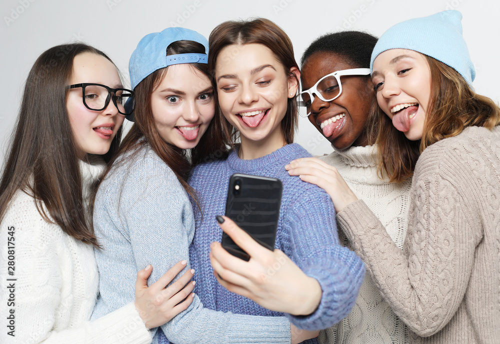  five different nation girls dressed in casual wear make selfie 