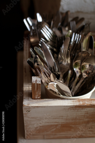 Kitchen cutlery kept in box, close up