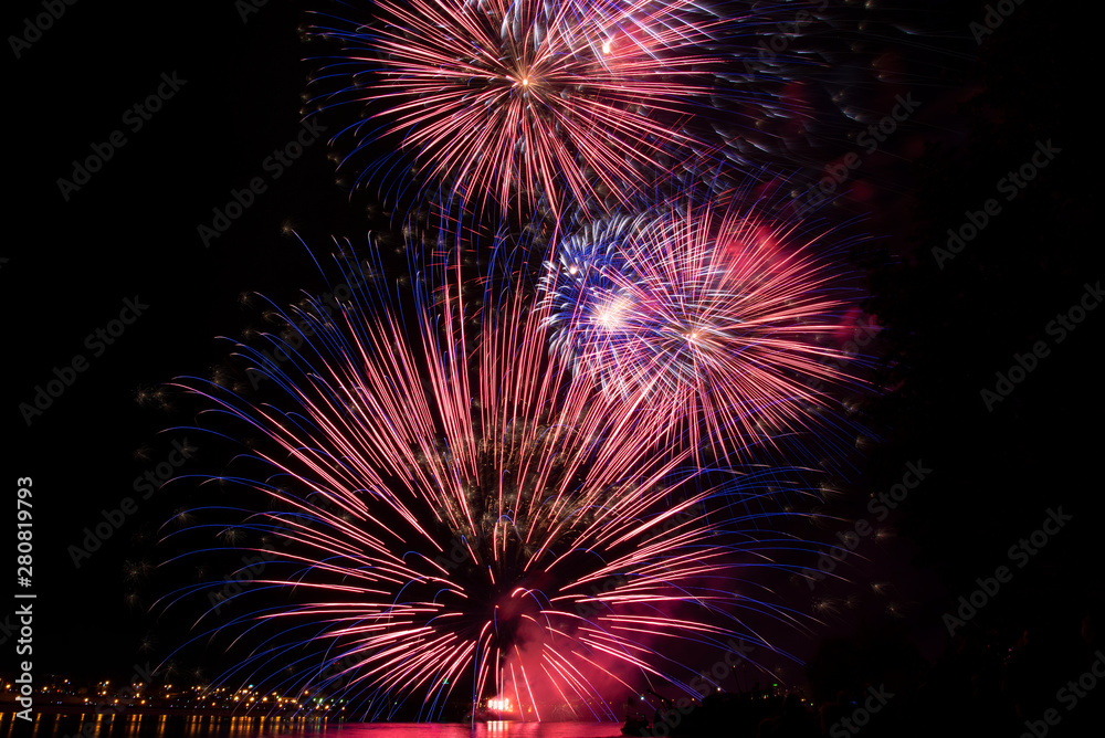 Festive fireworks. Fireworks. A huge firework in the sky. Bright explosions of fireworks. Colored sparks.Fireworks display on dark sky background.Fireworks.Colourful fireworks on the sky Festive fireworks. Fireworks. A huge firework in the sky. Bright explosions of fireworks. Colored sparks.Fireworks display on dark sky background.Fireworks.Colourful fireworks on the sky