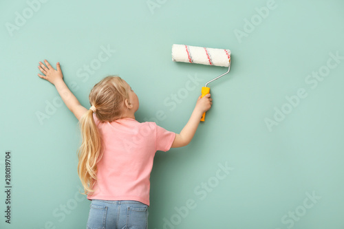 Little girl painting color ...