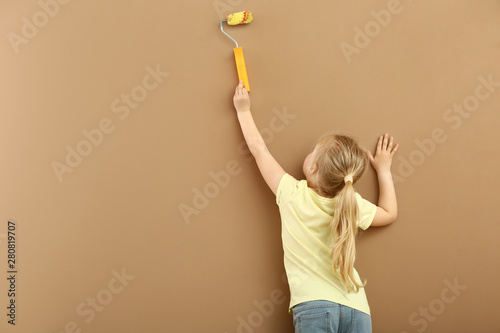 Little girl painting color ...