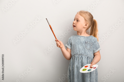 Little girl with palette an...