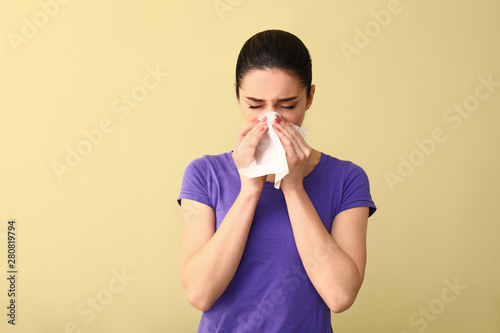 Young woman with nose wiper...