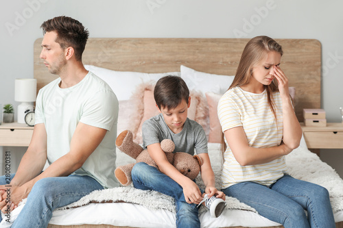 Sad family in bedroom after...