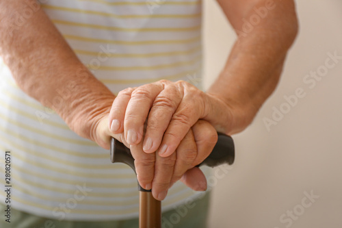 Elderly woman with walking ...